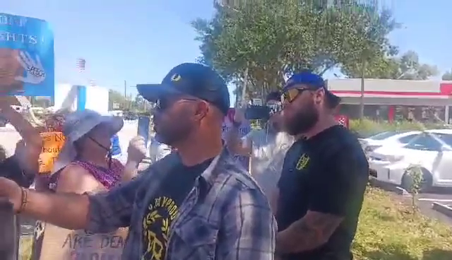 An American Convicted Seditionist and Far Right Activist at a Tesla Protest in Delray Beach